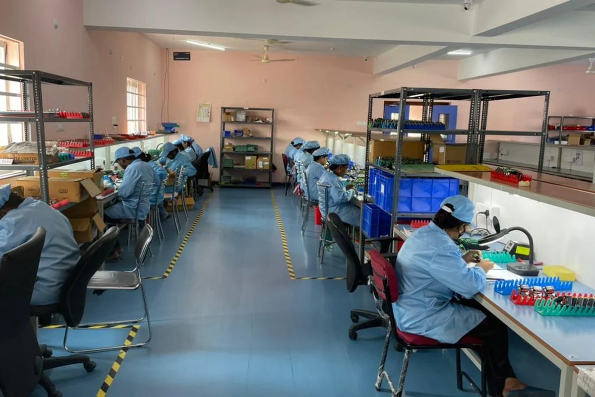 Rows of operators at assembly and test benches